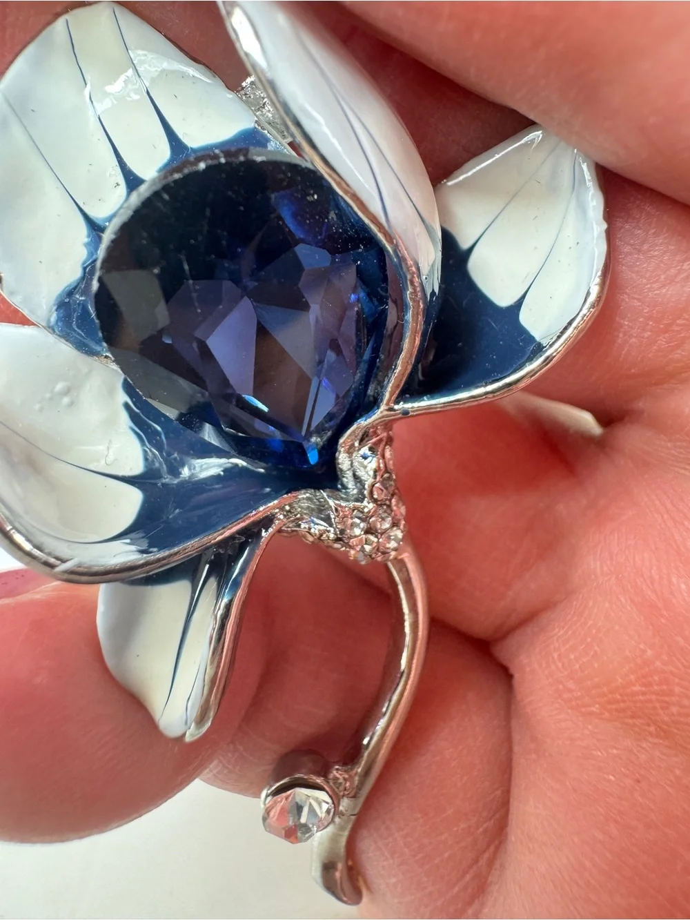 Silver Floral Brooch with Deep Blue Faceted Crystal